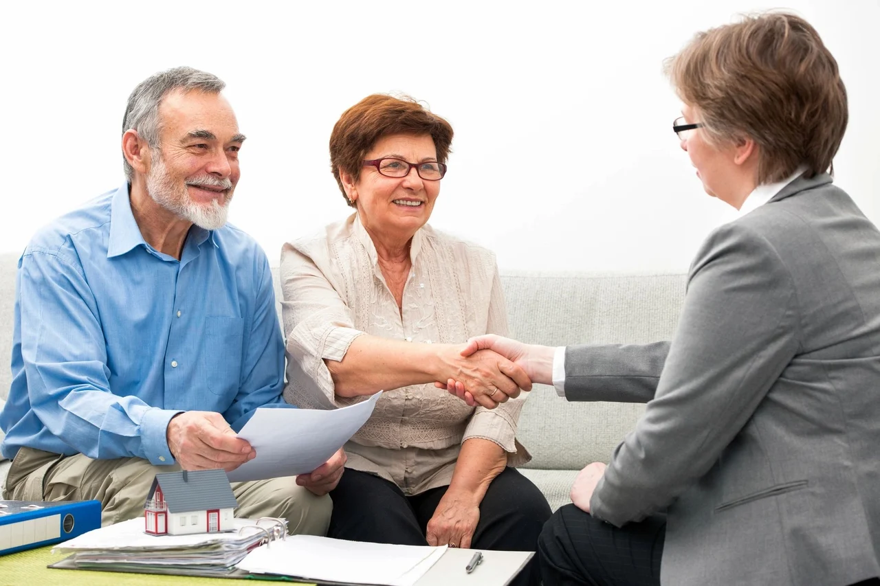 A couple meeting with a home financing advisor